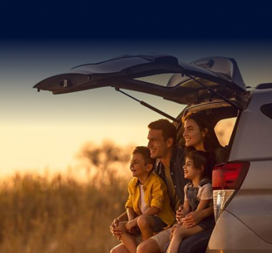 Pre-owned car loan banner showing a sleek car on a bridge at dusk
